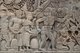 Cambodia: A woman pokes a turtle into a soldier's bottom giving him a shock as the Khmer army advances, bas-relief Eastern Wall, southern section, The Bayon, Angkor Thom