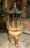 China: Incense urn at the 19th century Man Mo Temple, Tai Po, New Territories, Hong Kong. The temple is dedicated to Man Cheong, the God of Literature, and Mo Tai, the god of Martial Arts.<br/><br/>

Originally a sparsely populated area of farming and fishing villages, Hong Kong has become one of the world's most significant financial centres and commercial ports. It is the world's tenth-largest exporter and ninth-largest importer.<br/><br/>

Hong Kong became a colony of the British Empire after the Qing Empire ceded Hong Kong Island at the end of the First Opium War in 1842.