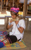 Thailand: A Padaung (Long Neck Karen) woman removing her neck rings for cleaning, village near Mae Hong Son. The Padaung or Kayan Lahwi or Long Necked Karen are a subgroup of the Kayan, a mix of Lawi, Kayan and several other tribes. Kayan are a subgroup of the Red Karen (Karenni) people, a Tibeto-Burman ethnic minority of Burma (Myanmar).