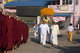 Burma / Myanmar: Laymen processing a Buddha image pass a line of Buddhist monks, Kyaing Tong (Kengtung), Shan State