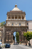 Italy: Porta Nuova (New Gate), originally built in the 15th century and rebuilt in 1584, but subsequently destroyed by fire in 1667 and rebuilt again in 1669, Palermo, Sicily. The gate commemorates the 1535 conquest of Tunis by Charles V (1500 - 1558), Holy Roman Emperor and Archduke of Austria.