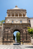 Italy: Porta Nuova (New Gate), originally built in the 15th century and rebuilt in 1584, but subsequently destroyed by fire in 1667 and rebuilt again in 1669, Palermo, Sicily. The gate commemorates the 1535 conquest of Tunis by Charles V (1500 - 1558), Holy Roman Emperor and Archduke of Austria.