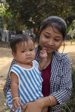 Cambodia: Cambodian mother and child, 2016. A young Cambodia villager holds her child.