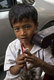 Cambodia: Boy begging in traffic, Phnom Penh, Cambodia
